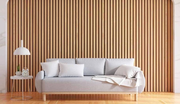 Slatted timber wall cladding in a living room, by Euro Homes