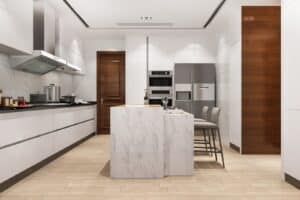 Modern custom kitchen with white high-gloss cabinets, marble island, built-in stainless steel appliances, wooden accents, and minimalist bar seating—designed for functionality and elegance